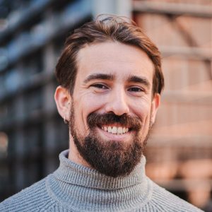 Stock portrait of a smiling bearded man